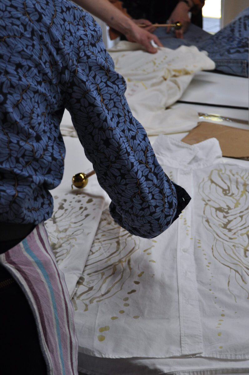 Drawing wax onto white fabric