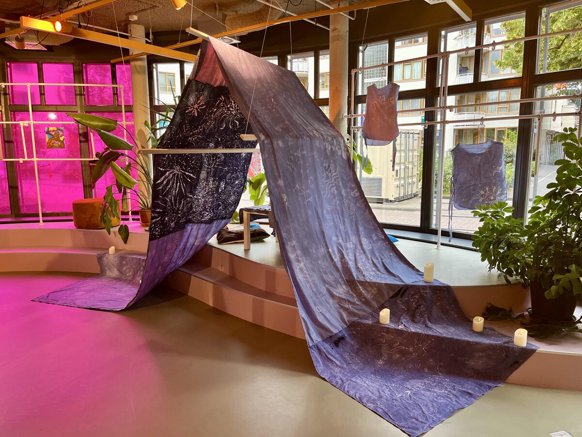 Batik tent tapestry flowing through the exhibition space